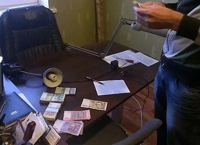 Харьковские правоохранители изъяли более полумиллиона гривен во время обысков у должностных лиц