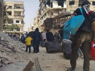 Сирийские повстанцы с семьями покинули еще один город вблизи Дамаска