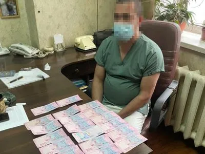 Вимагали гроші при видачі тіла померлої від COVID-19: у Києві затримали лікарів