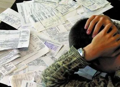 Долги по коммуналке: когда и как банки будут у украинцев-должников автоматически снимать деньги с их счетов?