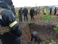 Минимум 17 тел: в Харьковской области обнаружили массовое захоронение