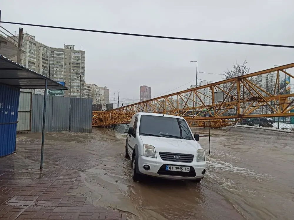 in-the-capital-a-crane-fell-and-damaged-a-water-supply-pipe-the-street-was-flooded