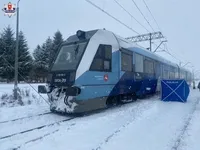 In Poland, a train hits two railroad workers who were clearing snow from the tracks, one is killed