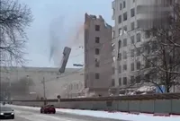 A wall nearly covered people and cars: a wall collapsed during the demolition of a university building in Russia