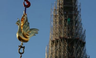 A copper rooster with Christian relics was installed on the spire of Notre Dame