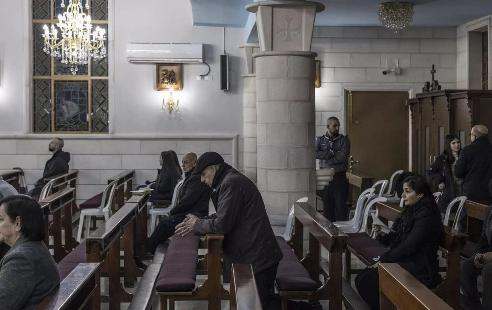 Христианский городок на Западном берегу реки Иордан, молится за мир в Газе