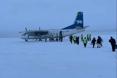 An-24 with 30 passengers lands on a frozen river in Yakutia