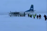 An-24 with 30 passengers lands on a frozen river in Yakutia