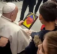 Pope Francis blesses Ukrainian children during visit to Vatican