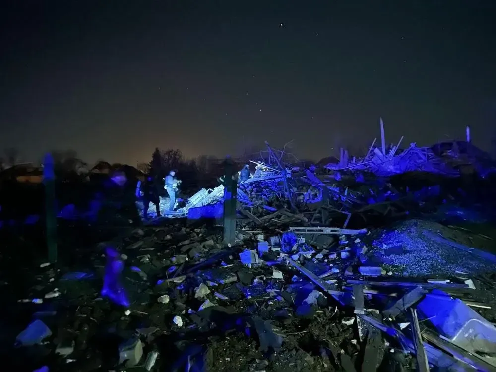 Rescuers pull out the body of a woman born in 1977 from the rubble in Kramatorsk