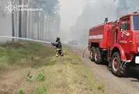 Firefighters prevent forest fire in Kharkiv region from spreading under enemy fire