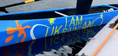 Ukrainian canoeist forced to tape over part of the "I am Ukrainian" sign on her boat at the Olympics