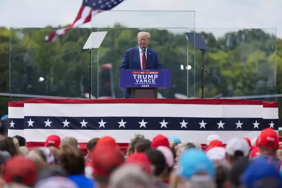 Trump speaks at a rally for the first time since the assassination attempt: the podium is surrounded by bulletproof glass