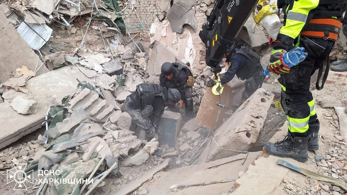 Woman's body pulled from the rubble after a Russian strike on a village council in Kozacha Lopan in Kharkiv region