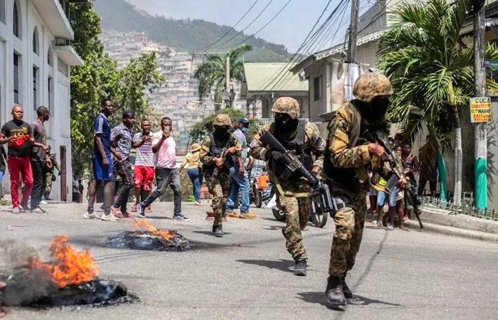 Armed gang kills at least 70 people, including children, in Haiti