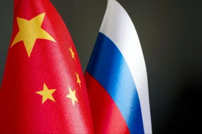 Britain warns china against supplying arms to russia