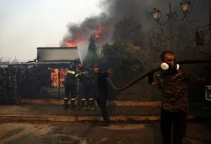Greece battles five major wildfires, evacuation underway near Athens
